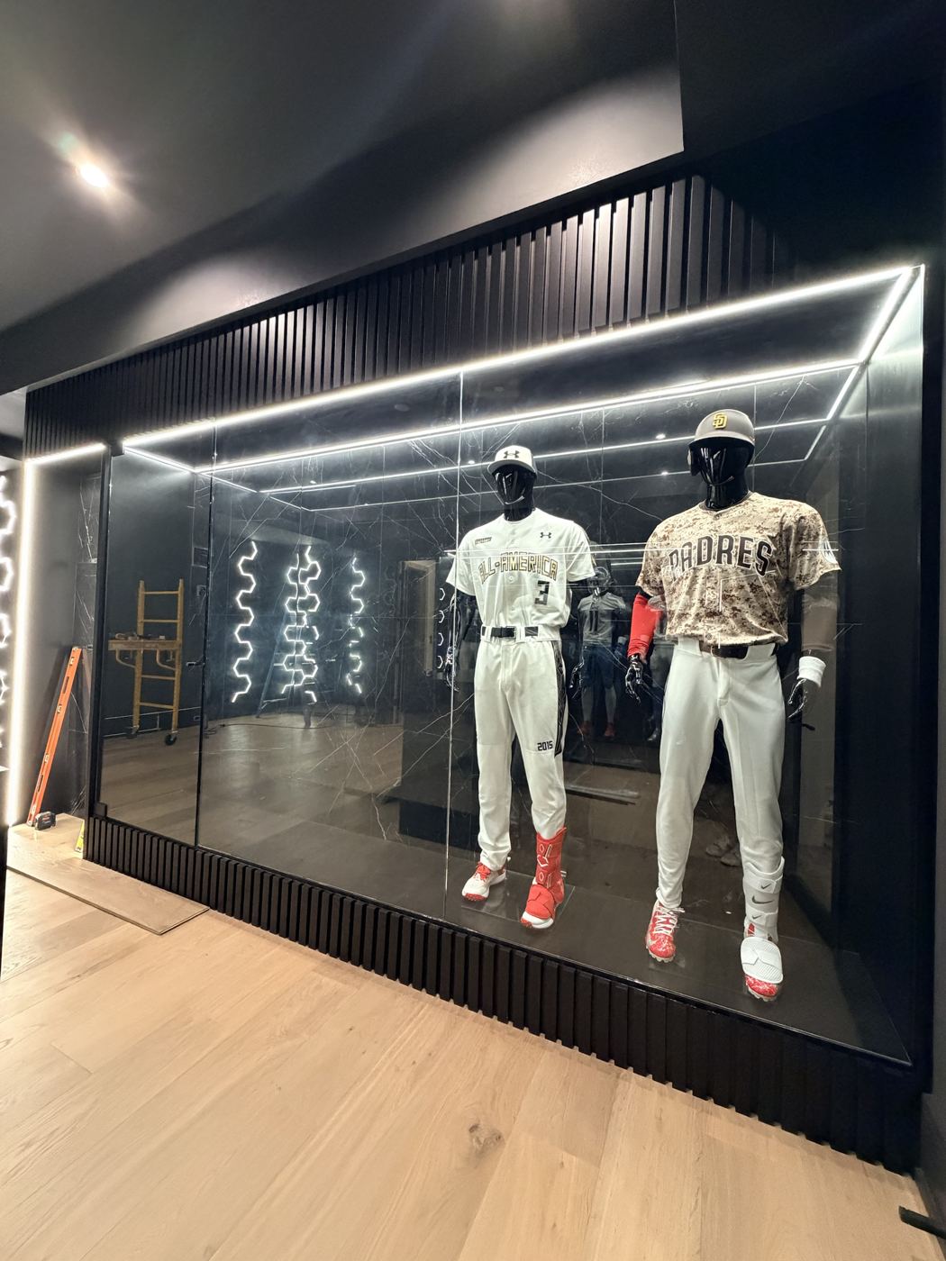 Glass display case for baseball uniforms